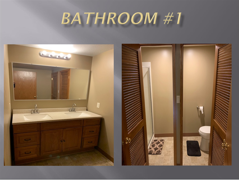 Double vanity bathroom with shower and toilet.