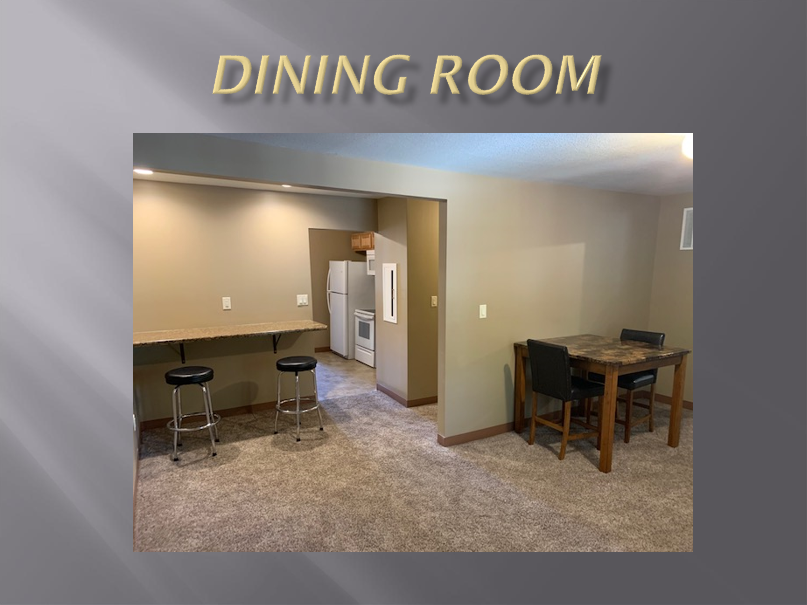 Empty dining room with table and chairs.