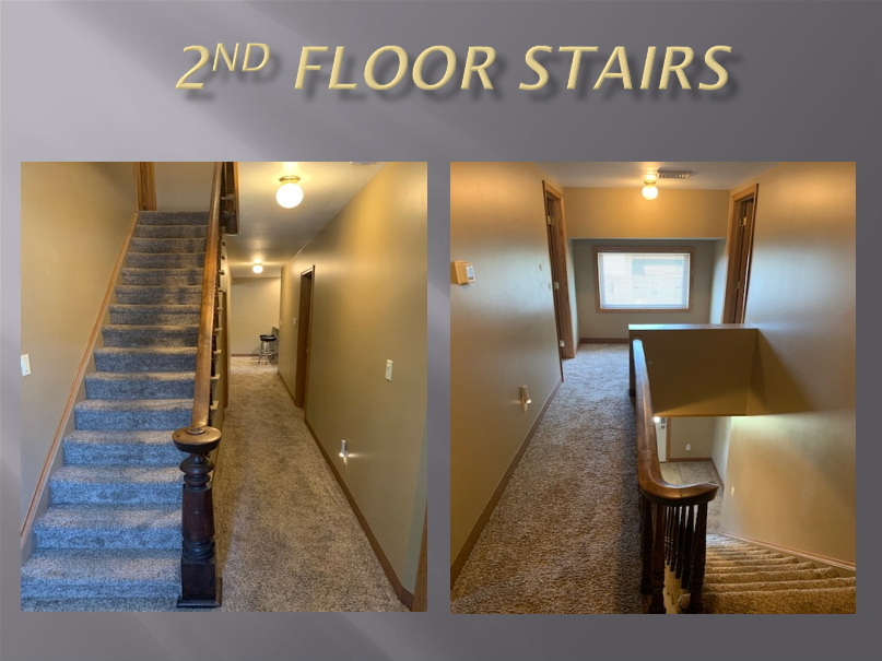 Carpeted hallway with wooden stairs.