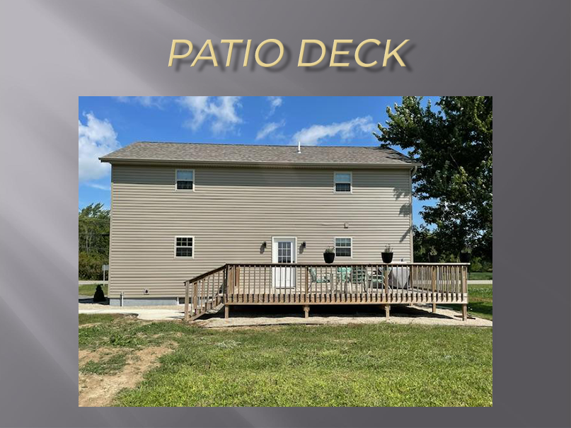 Wooden deck attached to house.